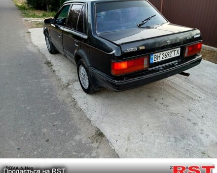 Черный Мазда 323, объемом двигателя 1.6 л и пробегом 300 тыс. км за 750 $, фото 3 на Automoto.ua