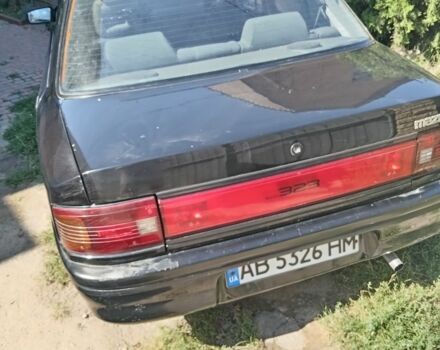 Черный Мазда 323, объемом двигателя 1.7 л и пробегом 187 тыс. км за 1500 $, фото 1 на Automoto.ua