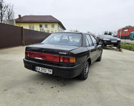 Черный Мазда 323, объемом двигателя 1.5 л и пробегом 400 тыс. км за 1200 $, фото 2 на Automoto.ua