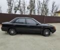 Черный Мазда 323, объемом двигателя 1.5 л и пробегом 400 тыс. км за 1200 $, фото 1 на Automoto.ua