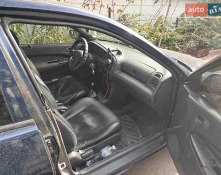 Черный Мазда 323, объемом двигателя 1.49 л и пробегом 319 тыс. км за 2400 $, фото 5 на Automoto.ua