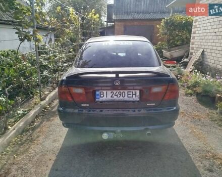 Черный Мазда 323, объемом двигателя 1.49 л и пробегом 319 тыс. км за 2400 $, фото 8 на Automoto.ua