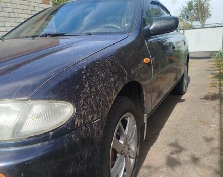 Черный Мазда 323, объемом двигателя 1.49 л и пробегом 319 тыс. км за 2400 $, фото 7 на Automoto.ua