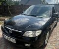 Чорний Мазда 323, об'ємом двигуна 1.6 л та пробігом 180 тис. км за 2500 $, фото 1 на Automoto.ua