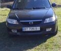 Чорний Мазда 323, об'ємом двигуна 1.6 л та пробігом 196 тис. км за 4500 $, фото 1 на Automoto.ua