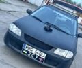 Черный Мазда 323, объемом двигателя 2 л и пробегом 374 тыс. км за 70000 $, фото 1 на Automoto.ua