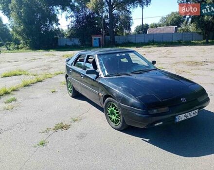 Чорний Мазда 323, об'ємом двигуна 1.84 л та пробігом 320 тис. км за 1900 $, фото 1 на Automoto.ua