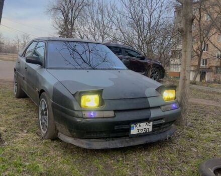 Черный Мазда 323, объемом двигателя 1.8 л и пробегом 300 тыс. км за 1200 $, фото 1 на Automoto.ua
