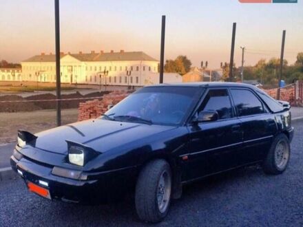 Черный Мазда 323, объемом двигателя 1.8 л и пробегом 300 тыс. км за 2000 $, фото 1 на Automoto.ua