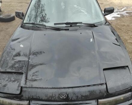 Черный Мазда 323, объемом двигателя 1.8 л и пробегом 125 тыс. км за 900 $, фото 1 на Automoto.ua