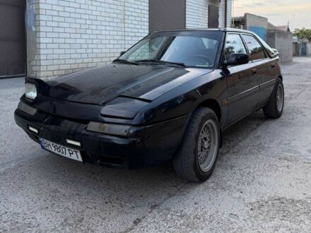 Мазда 323 1990 в Одессе на Automoto.ua Черный Мазда 323, объемом двигателя 1.8 л и пробегом 300 тыс. км за 1200 $, фото 1 на Automoto.ua