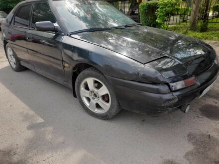Чорний Мазда 323, об'ємом двигуна 1.8 л та пробігом 313 тис. км за 850 $, фото 1 на Automoto.ua