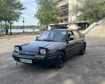 Чорний Мазда 323, об'ємом двигуна 1.9 л та пробігом 200 тис. км за 1750 $, фото 1 на Automoto.ua