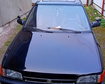 Чорний Мазда 323, об'ємом двигуна 1.7 л та пробігом 300 тис. км за 700 $, фото 1 на Automoto.ua
