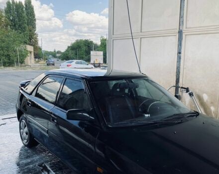 Чорний Мазда 323, об'ємом двигуна 1.6 л та пробігом 50 тис. км за 1600 $, фото 1 на Automoto.ua