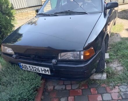 Чорний Мазда 323, об'ємом двигуна 1.7 л та пробігом 187 тис. км за 1500 $, фото 1 на Automoto.ua