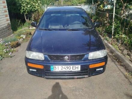 Черный Мазда 323, объемом двигателя 1.49 л и пробегом 319 тыс. км за 2400 $, фото 1 на Automoto.ua