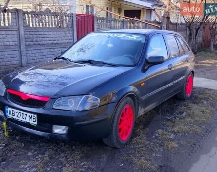 Чорний Мазда 323, об'ємом двигуна 1.49 л та пробігом 250 тис. км за 1400 $, фото 1 на Automoto.ua