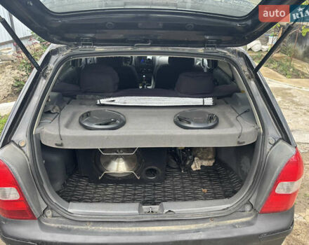 Черный Мазда 323, объемом двигателя 1.5 л и пробегом 247 тыс. км за 1900 $, фото 1 на Automoto.ua