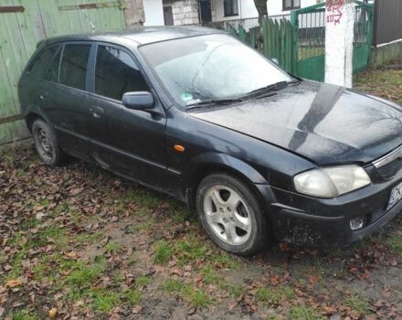 Черный Мазда 323, объемом двигателя 2 л и пробегом 260 тыс. км за 700 $, фото 1 на Automoto.ua
