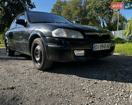 Черный Мазда 323, объемом двигателя 1.6 л и пробегом 200 тыс. км за 2300 $, фото 1 на Automoto.ua