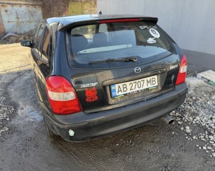 Черный Мазда 323, объемом двигателя 1.5 л и пробегом 245 тыс. км за 1900 $, фото 1 на Automoto.ua