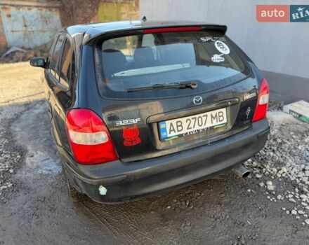 Черный Мазда 323, объемом двигателя 1.49 л и пробегом 245 тыс. км за 1900 $, фото 1 на Automoto.ua