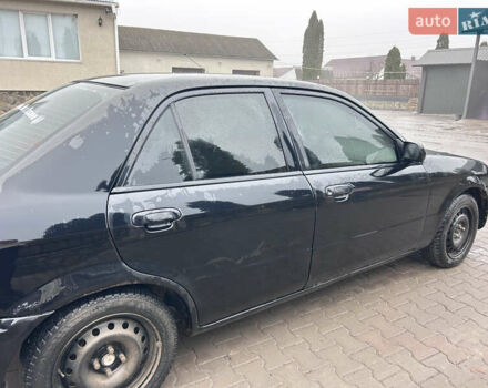 Черный Мазда 323, объемом двигателя 1.6 л и пробегом 215 тыс. км за 2300 $, фото 1 на Automoto.ua