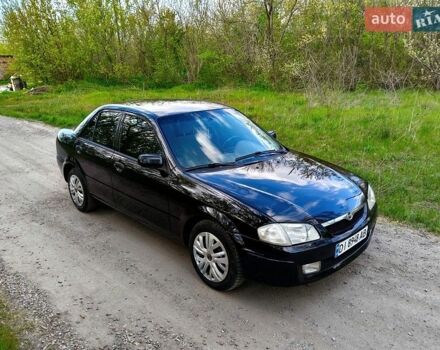 Черный Мазда 323, объемом двигателя 1.6 л и пробегом 217 тыс. км за 2800 $, фото 1 на Automoto.ua