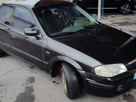 Чорний Мазда 323, об'ємом двигуна 1.8 л та пробігом 383 тис. км за 1214 $, фото 1 на Automoto.ua