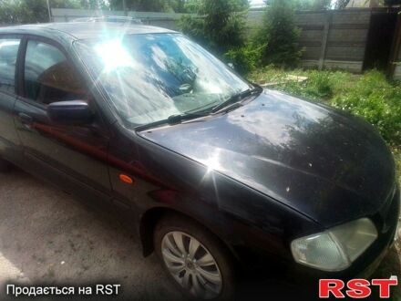 Чорний Мазда 323, об'ємом двигуна 1.5 л та пробігом 0 тис. км за 2100 $, фото 1 на Automoto.ua