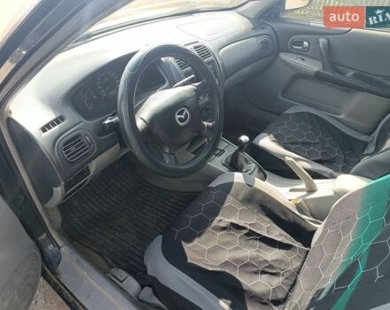 Черный Мазда 323, объемом двигателя 1.6 л и пробегом 283 тыс. км за 2333 $, фото 1 на Automoto.ua