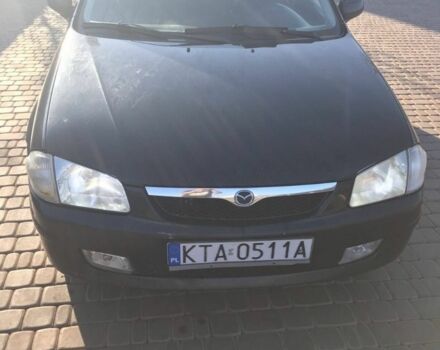 Черный Мазда 323, объемом двигателя 2 л и пробегом 333 тыс. км за 673 $, фото 1 на Automoto.ua