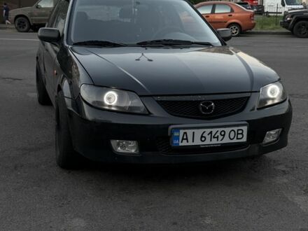 Чорний Мазда 323, об'ємом двигуна 2 л та пробігом 300 тис. км за 1850 $, фото 1 на Automoto.ua