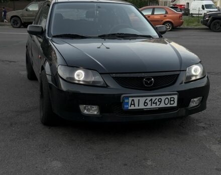 Чорний Мазда 323, об'ємом двигуна 2 л та пробігом 300 тис. км за 1850 $, фото 1 на Automoto.ua