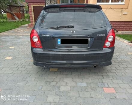 Чорний Мазда 323, об'ємом двигуна 2 л та пробігом 268 тис. км за 1950 $, фото 1 на Automoto.ua