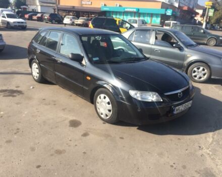 Черный Мазда 323, объемом двигателя 2 л и пробегом 200 тыс. км за 950 $, фото 1 на Automoto.ua