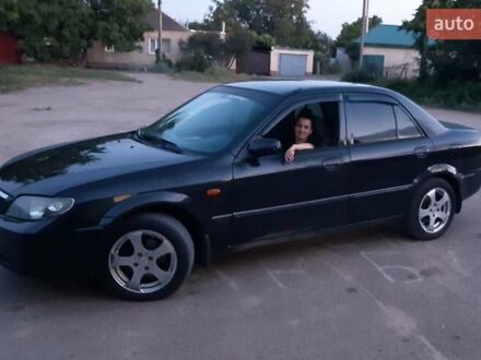 Мазда 323 2002 в Вознесенске на Automoto.ua Черный Мазда 323, объемом двигателя 1.6 л и пробегом 320 тыс. км за 5000 $, фото 1 на Automoto.ua