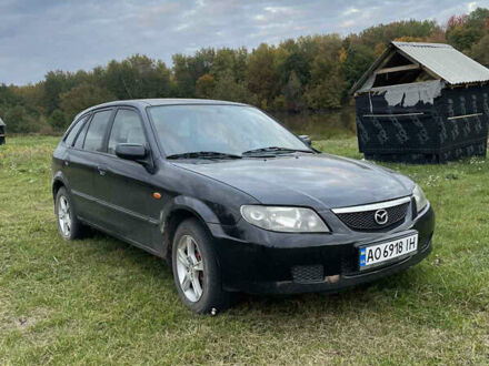 Черный Мазда 323, объемом двигателя 2 л и пробегом 320 тыс. км за 2700 $, фото 1 на Automoto.ua