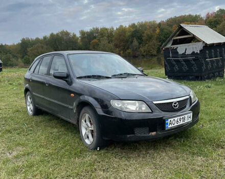 Черный Мазда 323, объемом двигателя 2 л и пробегом 320 тыс. км за 2700 $, фото 1 на Automoto.ua