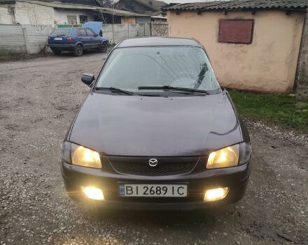 Фиолетовый Мазда 323, объемом двигателя 1.5 л и пробегом 310 тыс. км за 800 $, фото 1 на Automoto.ua