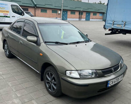 Коричневый Мазда 323, объемом двигателя 1.6 л и пробегом 199 тыс. км за 2600 $, фото 2 на Automoto.ua