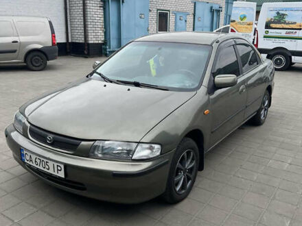 Коричневый Мазда 323, объемом двигателя 1.6 л и пробегом 199 тыс. км за 2600 $, фото 1 на Automoto.ua