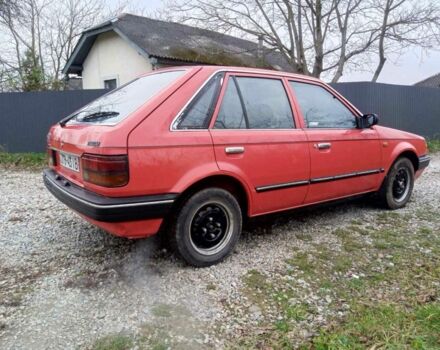 Червоний Мазда 323, об'ємом двигуна 1.3 л та пробігом 250 тис. км за 950 $, фото 7 на Automoto.ua