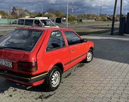 Красный Мазда 323, объемом двигателя 1.3 л и пробегом 225 тыс. км за 650 $, фото 3 на Automoto.ua