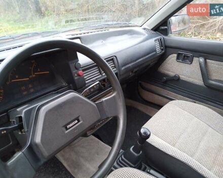 Червоний Мазда 323, об'ємом двигуна 1.3 л та пробігом 250 тис. км за 950 $, фото 9 на Automoto.ua