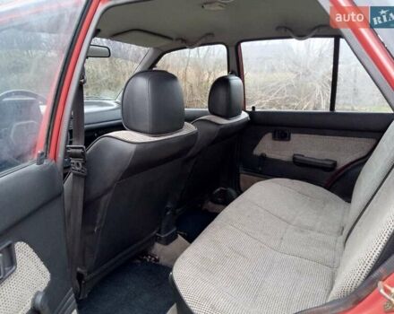 Червоний Мазда 323, об'ємом двигуна 1.3 л та пробігом 250 тис. км за 950 $, фото 10 на Automoto.ua