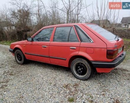 Червоний Мазда 323, об'ємом двигуна 1.3 л та пробігом 250 тис. км за 950 $, фото 3 на Automoto.ua