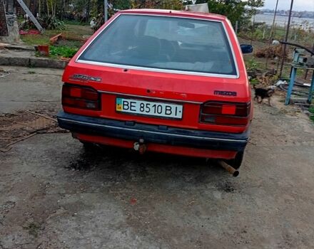 Красный Мазда 323, объемом двигателя 1.7 л и пробегом 370 тыс. км за 450 $, фото 1 на Automoto.ua