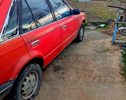 Красный Мазда 323, объемом двигателя 1.7 л и пробегом 370 тыс. км за 450 $, фото 2 на Automoto.ua